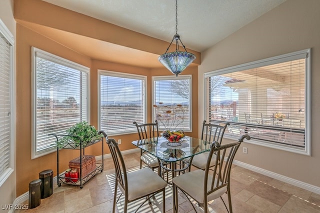 dining area with lofted ceiling