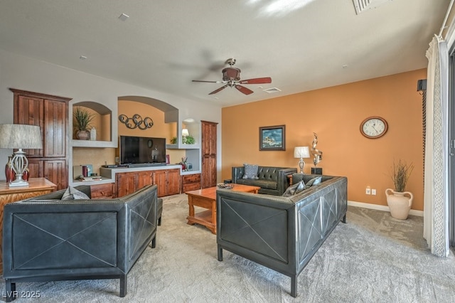 living room featuring ceiling fan and light colored carpet