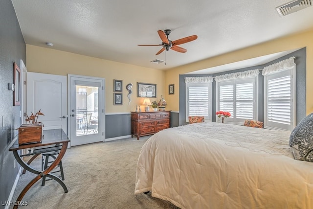 carpeted bedroom with a textured ceiling, access to outside, and ceiling fan