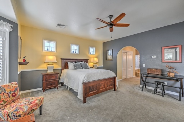 bedroom with light carpet and ceiling fan