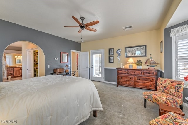 carpeted bedroom featuring multiple windows, access to exterior, and ceiling fan