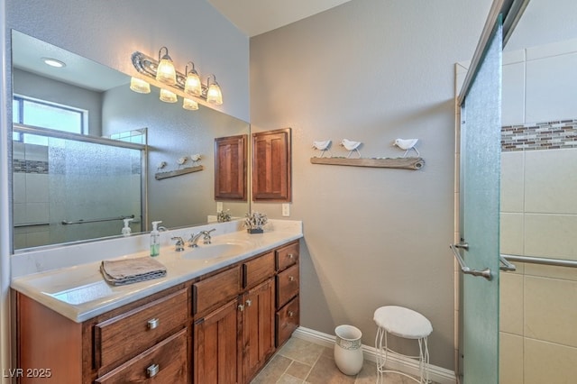 bathroom featuring vanity and a shower with door