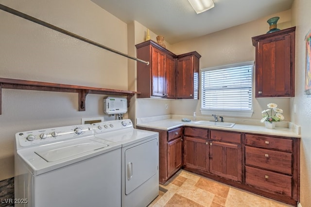 laundry area with cabinets, sink, and independent washer and dryer