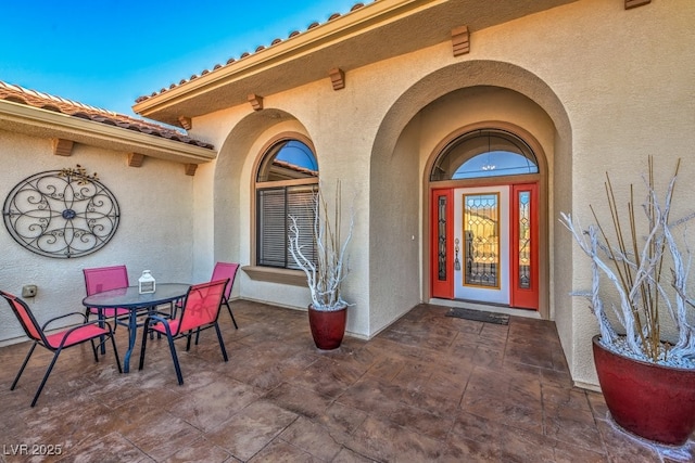 property entrance with a patio