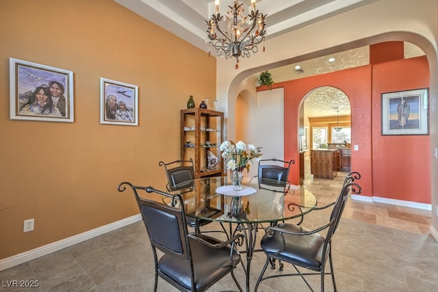 dining space featuring an inviting chandelier