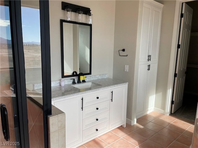 bathroom with vanity and tile patterned flooring