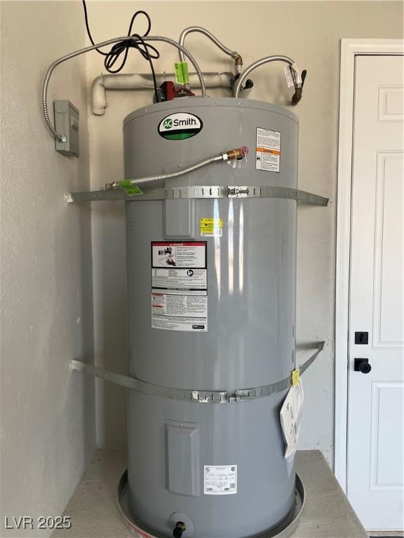 utility room featuring secured water heater