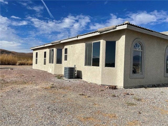 view of property exterior with cooling unit