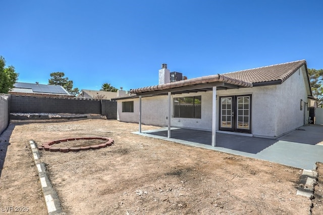 back of property featuring a patio