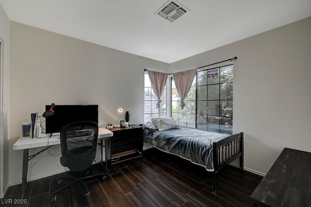 bedroom featuring dark hardwood / wood-style floors