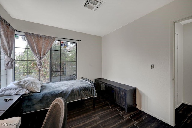 bedroom with multiple windows