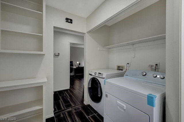 clothes washing area with washer and dryer