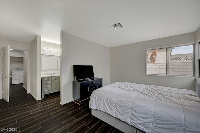 bedroom featuring sink and ensuite bathroom