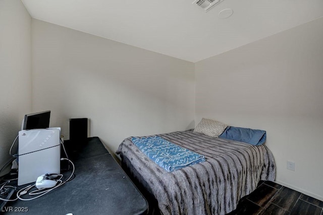 bedroom featuring dark hardwood / wood-style floors