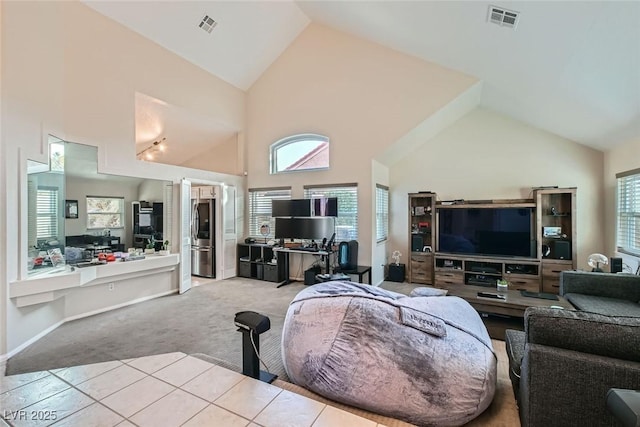 living room featuring light colored carpet and high vaulted ceiling