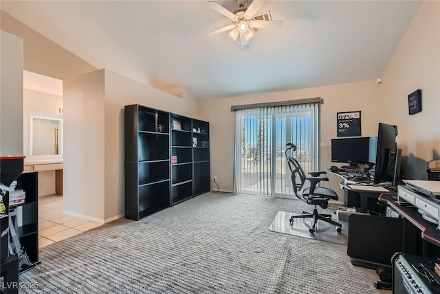 carpeted home office with lofted ceiling and ceiling fan