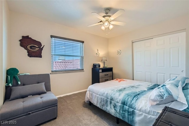 bedroom featuring carpet, ceiling fan, and a closet