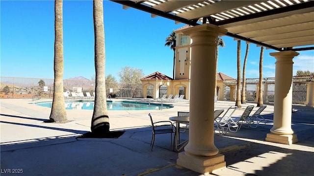 view of swimming pool with a pergola and a patio area