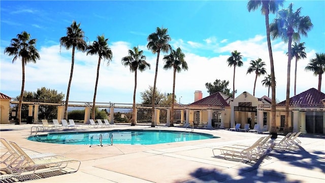 view of swimming pool featuring a patio area