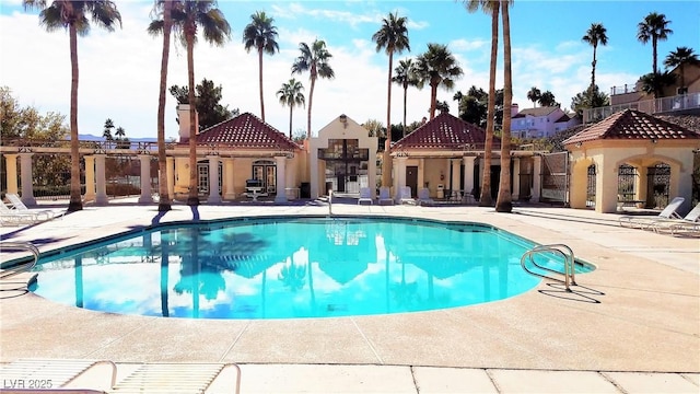 view of swimming pool with a patio area