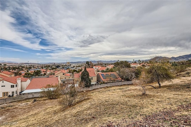 drone / aerial view featuring a mountain view and a residential view