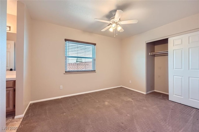 unfurnished bedroom with a ceiling fan, baseboards, a closet, and light carpet