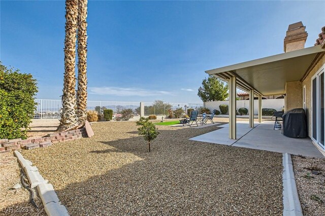 view of yard featuring a patio and a fenced backyard