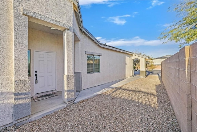 view of side of property featuring a patio