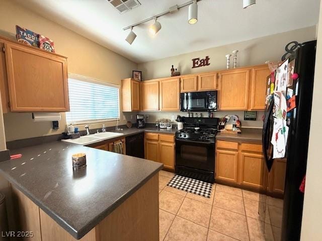 kitchen featuring light tile patterned floors, black appliances, and kitchen peninsula