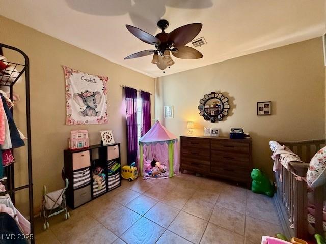 game room with light tile patterned floors and ceiling fan