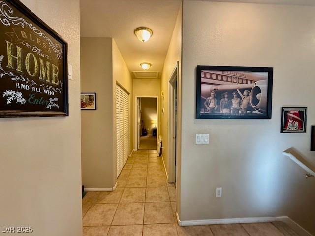 hallway with light tile patterned floors