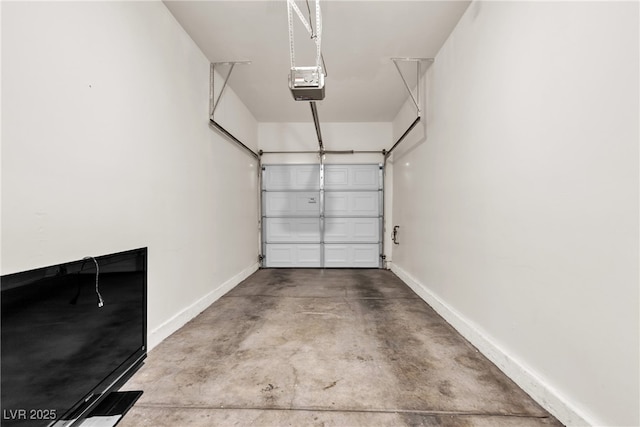 9323 Leaping Deer Pl Unit 102, Las Vegas, NV 89178 - garage featuring a garage door opener and baseboards