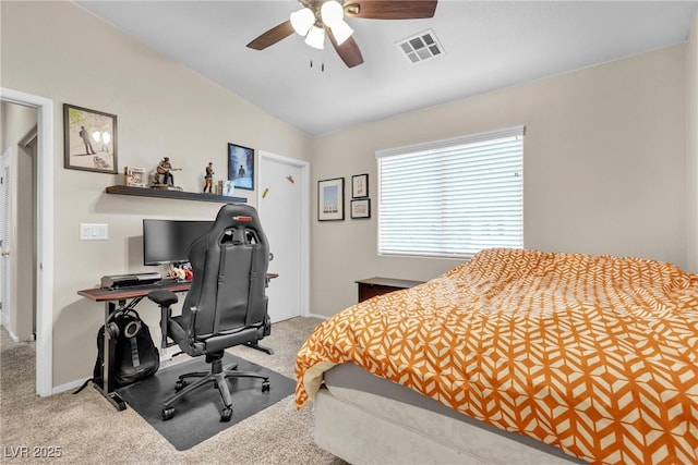 carpeted bedroom featuring lofted ceiling and ceiling fan