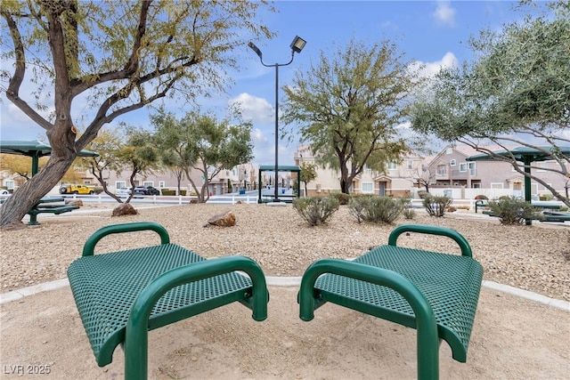 view of home's community featuring a playground