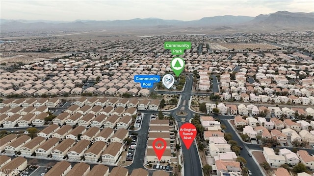 birds eye view of property with a mountain view