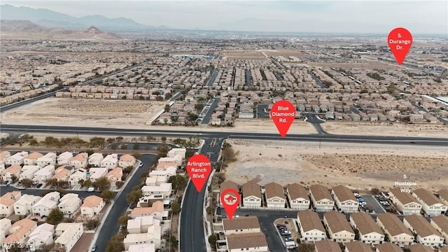 birds eye view of property with a mountain view