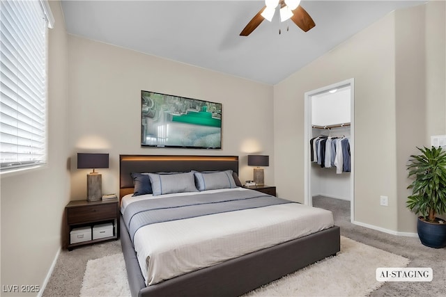 9323 Leaping Deer Pl Unit 102, Las Vegas, NV 89178 - bedroom featuring carpet, baseboards, a walk in closet, vaulted ceiling, and a closet