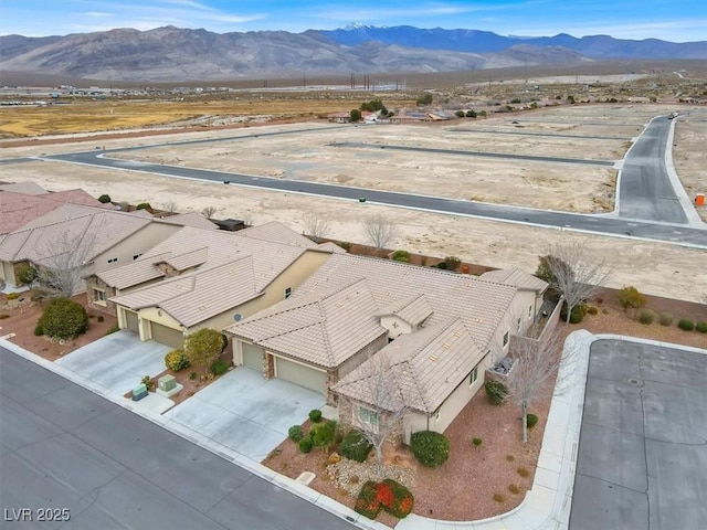 birds eye view of property featuring a mountain view