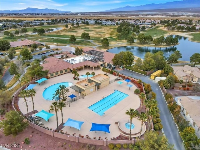 bird's eye view with a water and mountain view