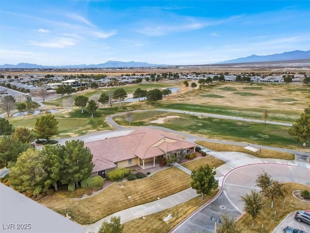 birds eye view of property with a mountain view