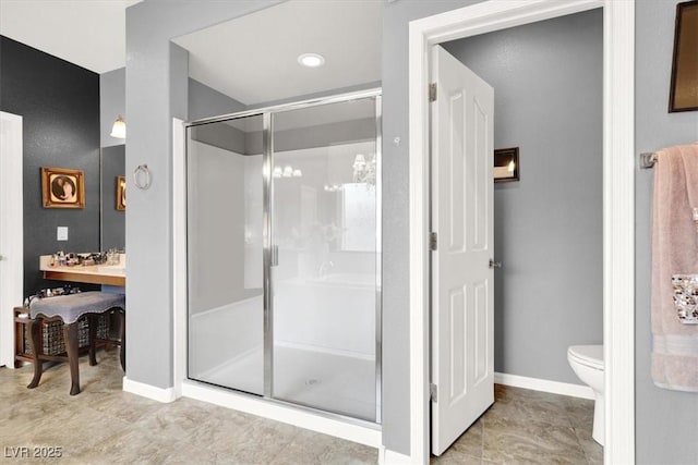 bathroom featuring an enclosed shower and toilet