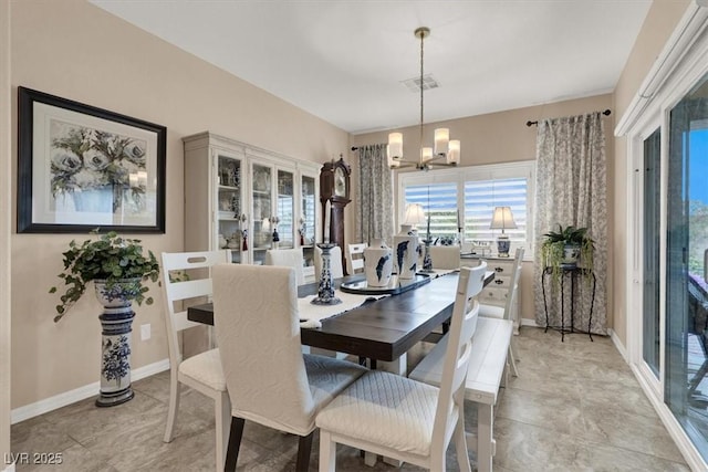 dining space featuring an inviting chandelier