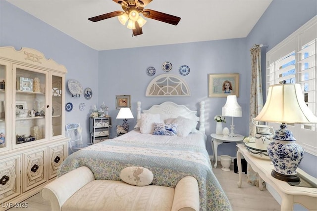 bedroom with ceiling fan and light wood-type flooring