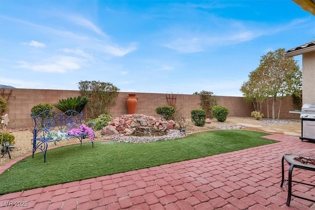 view of patio with a grill