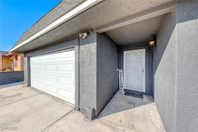 doorway to property featuring a garage