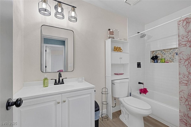 full bathroom with vanity, hardwood / wood-style floors, shower / tub combo, and toilet