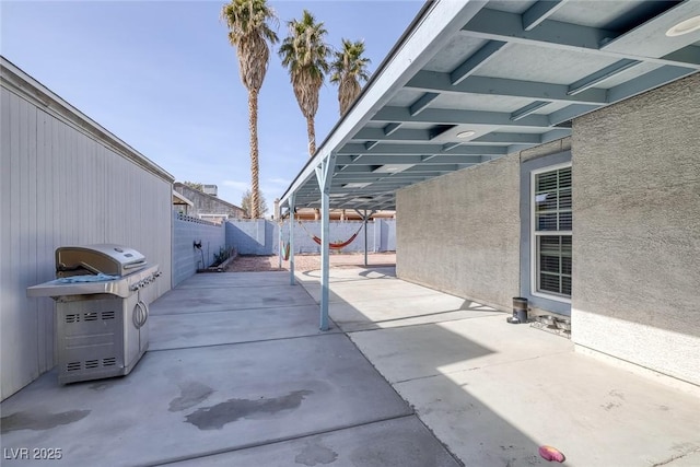 view of patio featuring a grill