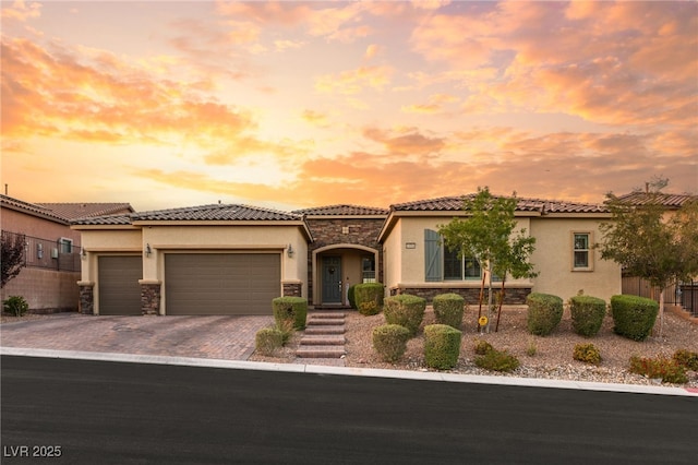 mediterranean / spanish house with a garage