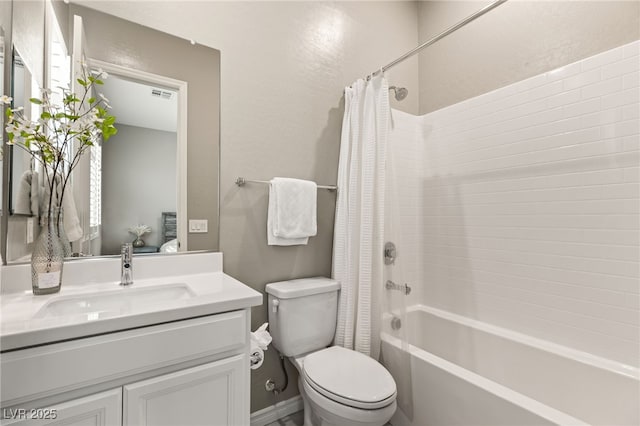 full bathroom featuring shower / tub combo with curtain, vanity, and toilet