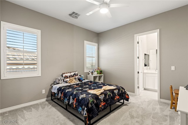 carpeted bedroom featuring ceiling fan and connected bathroom